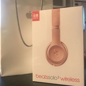 Rose gold Beats wired/wireless headsets